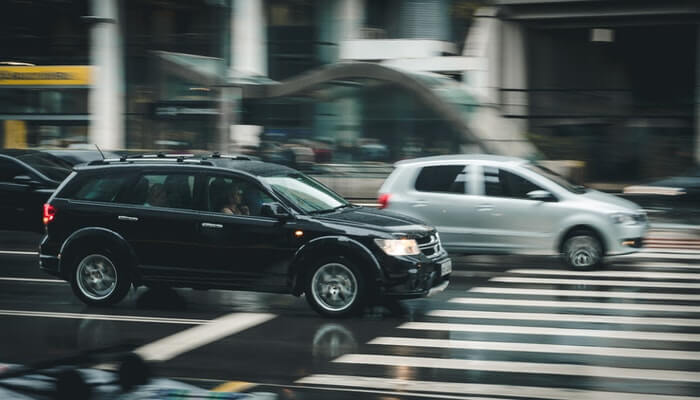 SUV driving in city